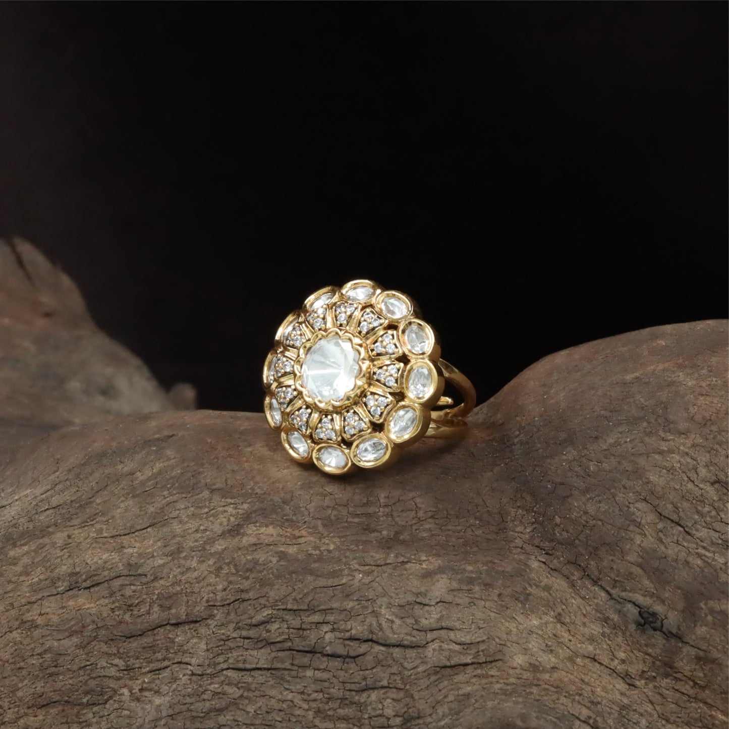 Central bloom kundan finger ring with scalloped round core and surrounding oval units