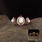Triple design kundan finger ring with centre setting and matching side clusters