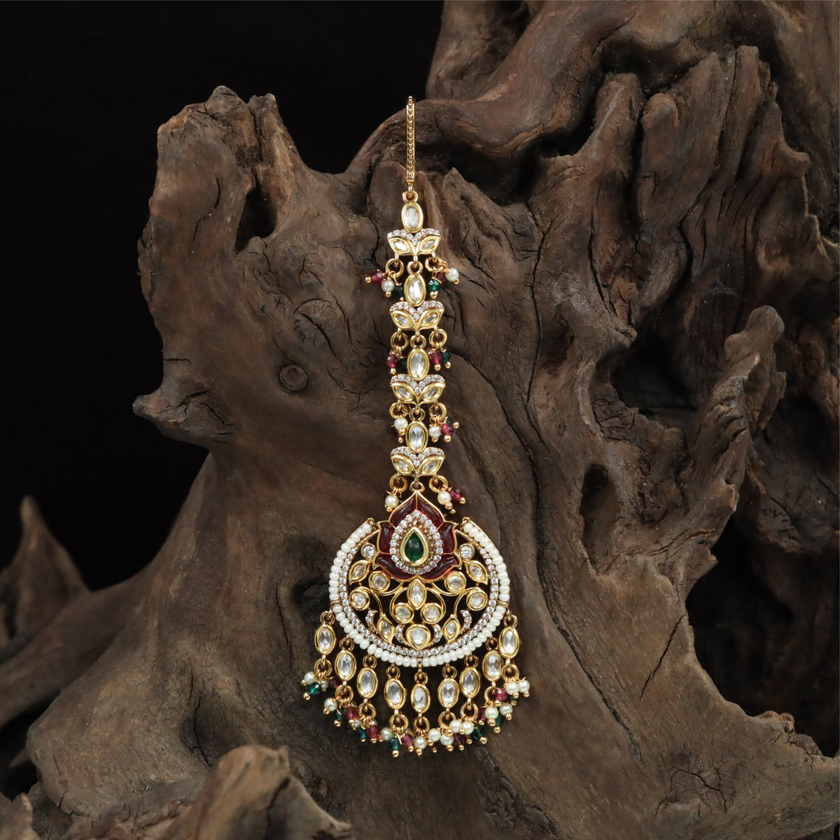 Radiant Kundan Tikka with Arched Frame and Layered Drop Hangings