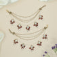 Fine triple chain mati with bead strands and clustered hanging elements