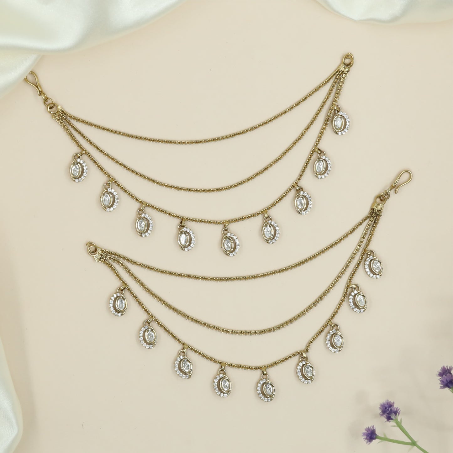 Minimal drape chain mati with oval framed hangings and neat spacing