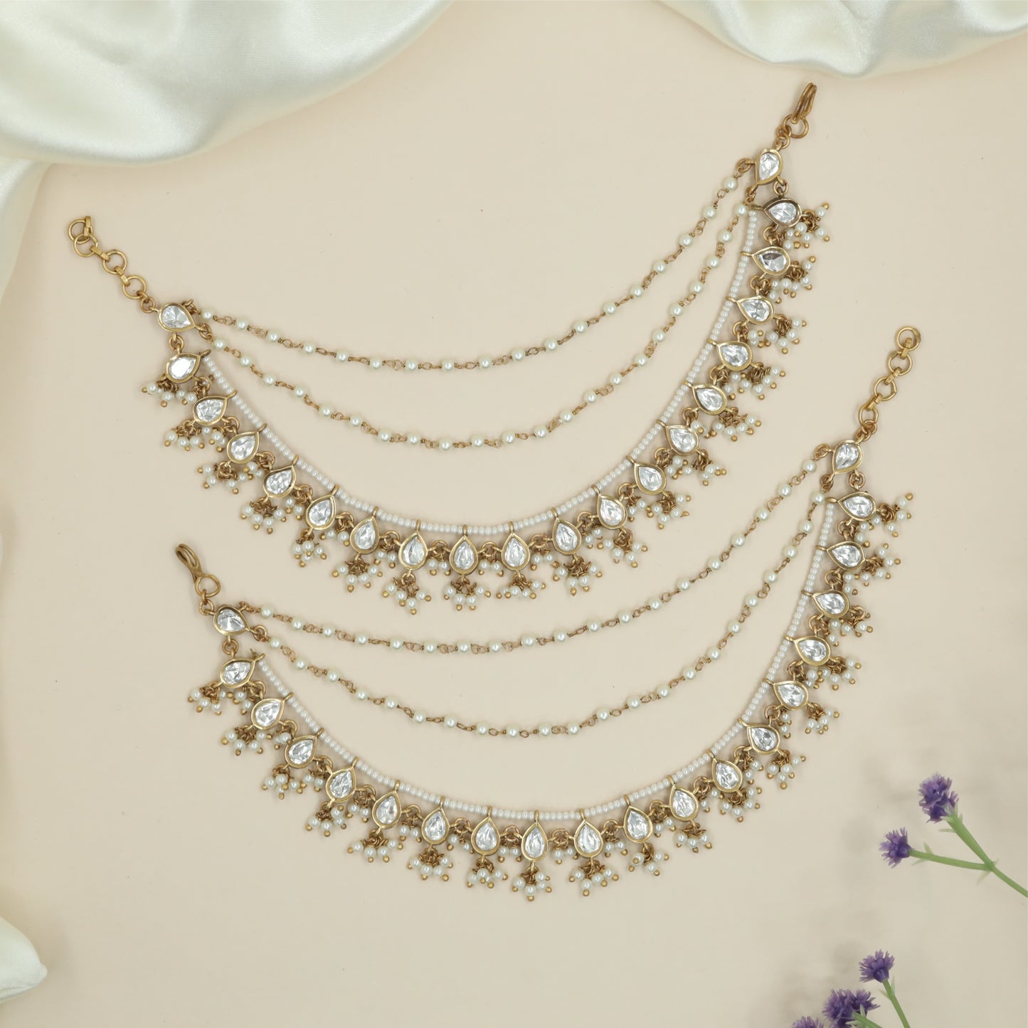 Multi strand beads kundan mati with draped chains and framed drop elements
