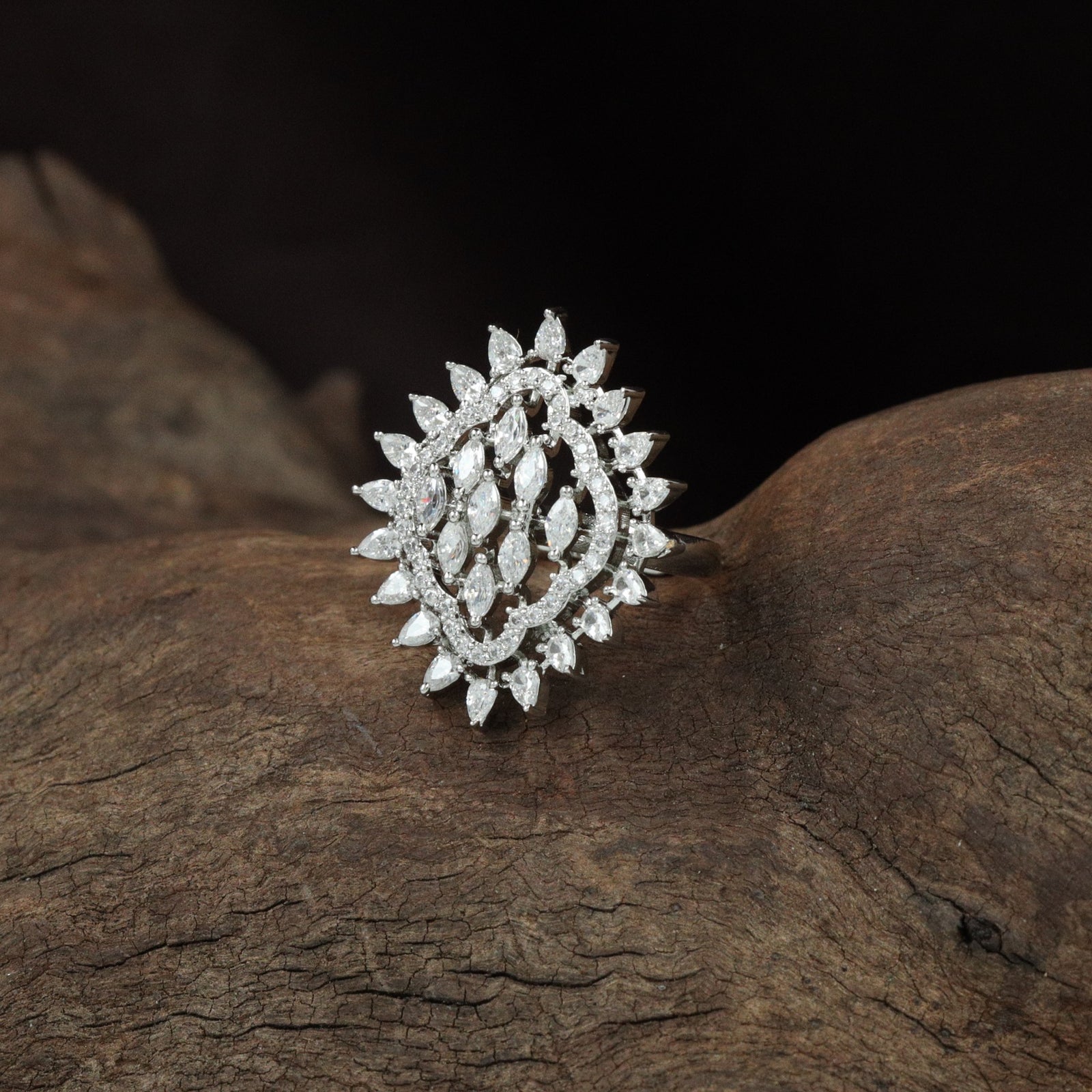 Segment floral form finger ring craft with intricate lattice detailing
