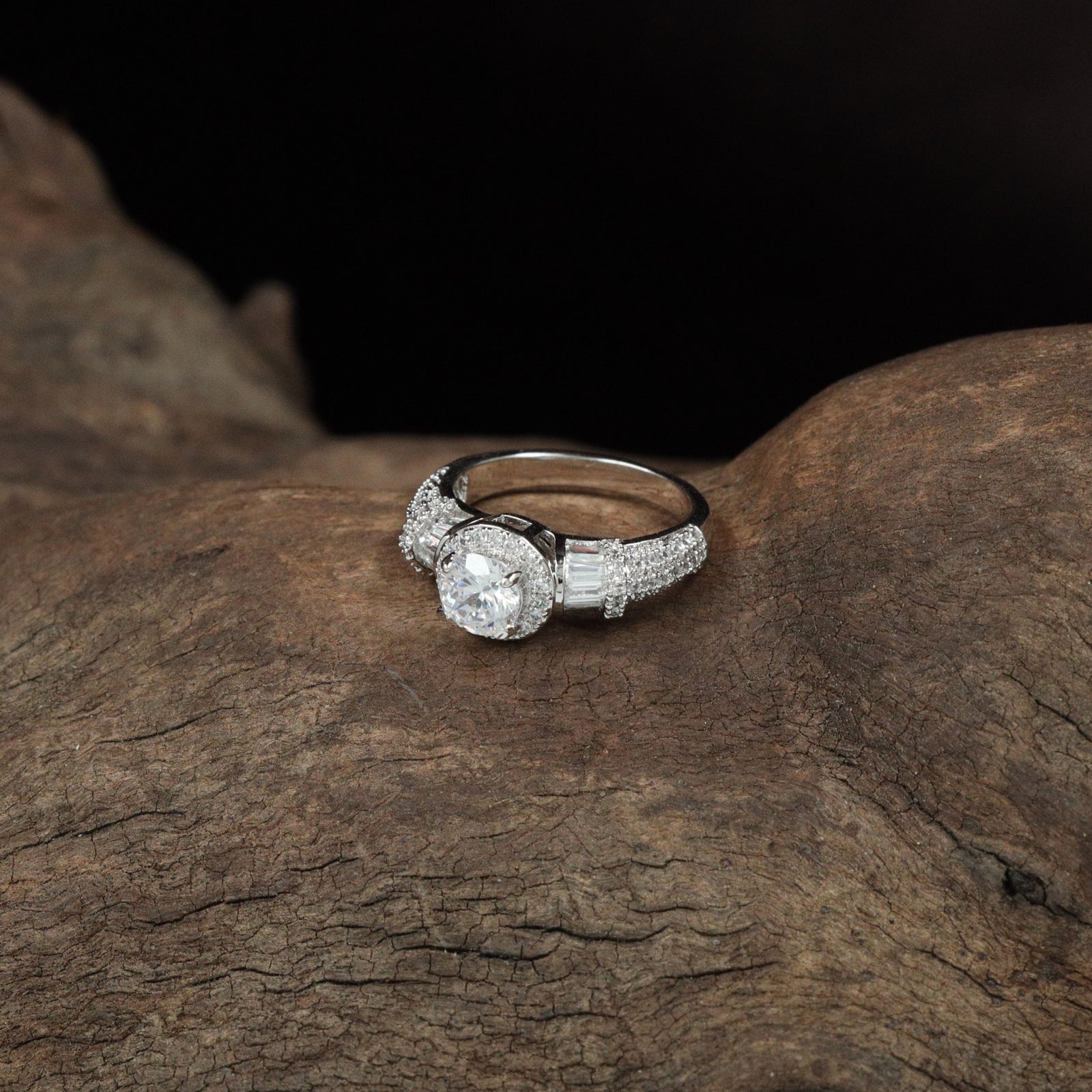 Grand Orbit Rhodium Finger Ring with Textured Band Layout