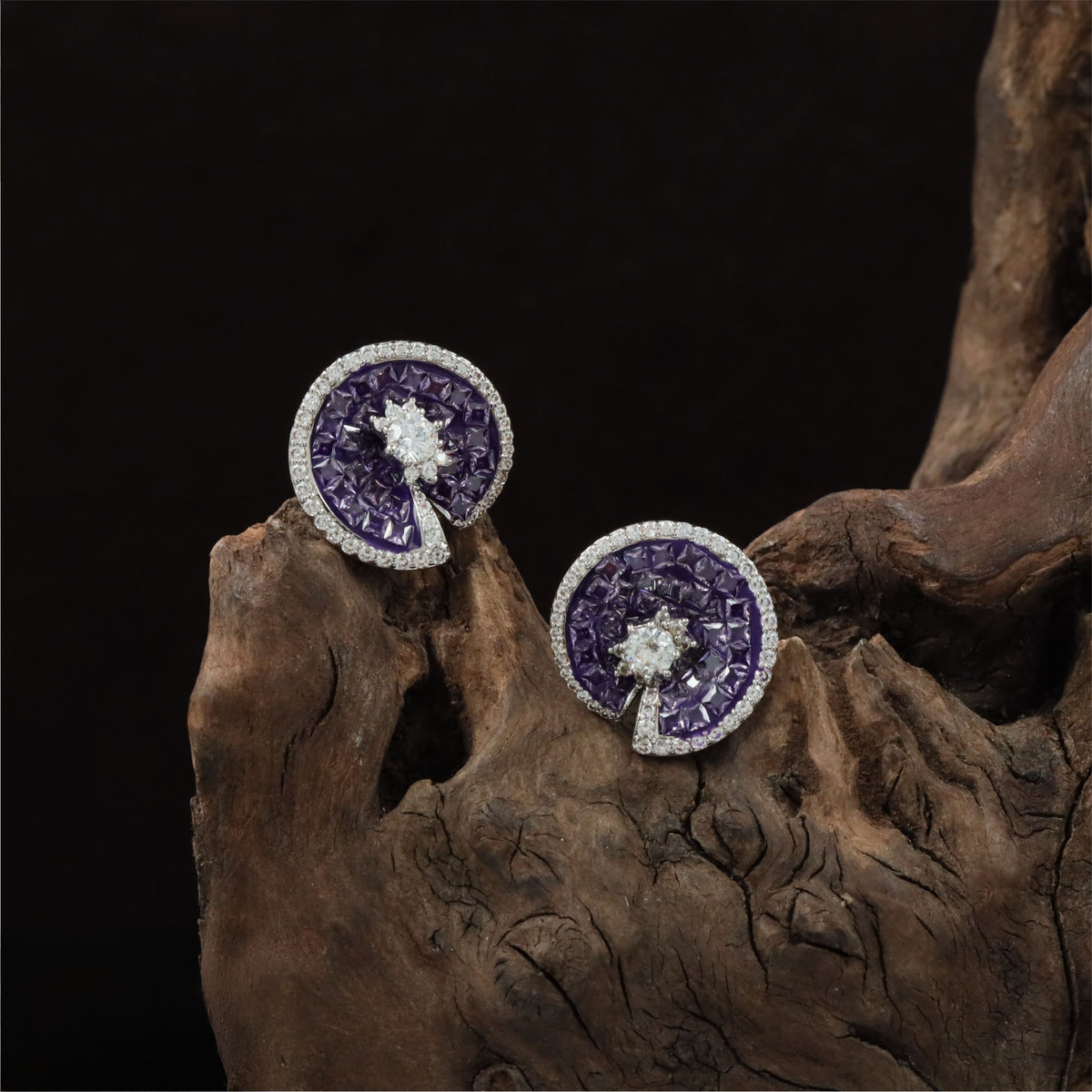 Signature swirl-pattern Rhodium Studs with fine detailing