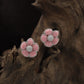 Radiant Blossom Rhodium Stud with Structured Floral Arrangement