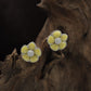 Radiant Blossom Rhodium Stud with Structured Floral Arrangement