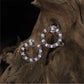 Open Circle Rhodium Studs With Alternating Oval Accents