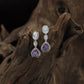 Jewel Drop Rhodium Hanging with Layered Border Arrangement