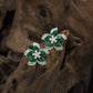 Premium Rhodium studs with intricate petal settings