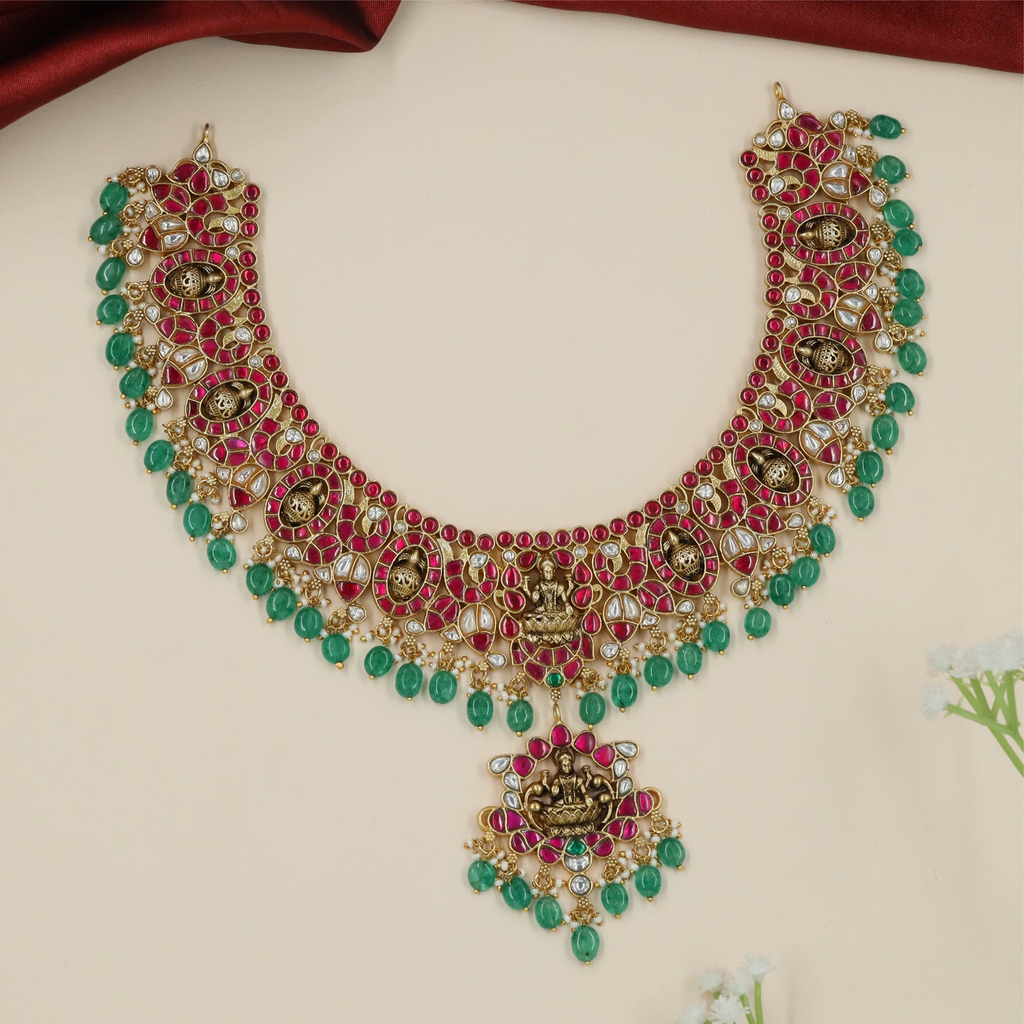 Ornate Oval Jadau Necklace with Embedded Lakshmi Panels and Curved Border Layout