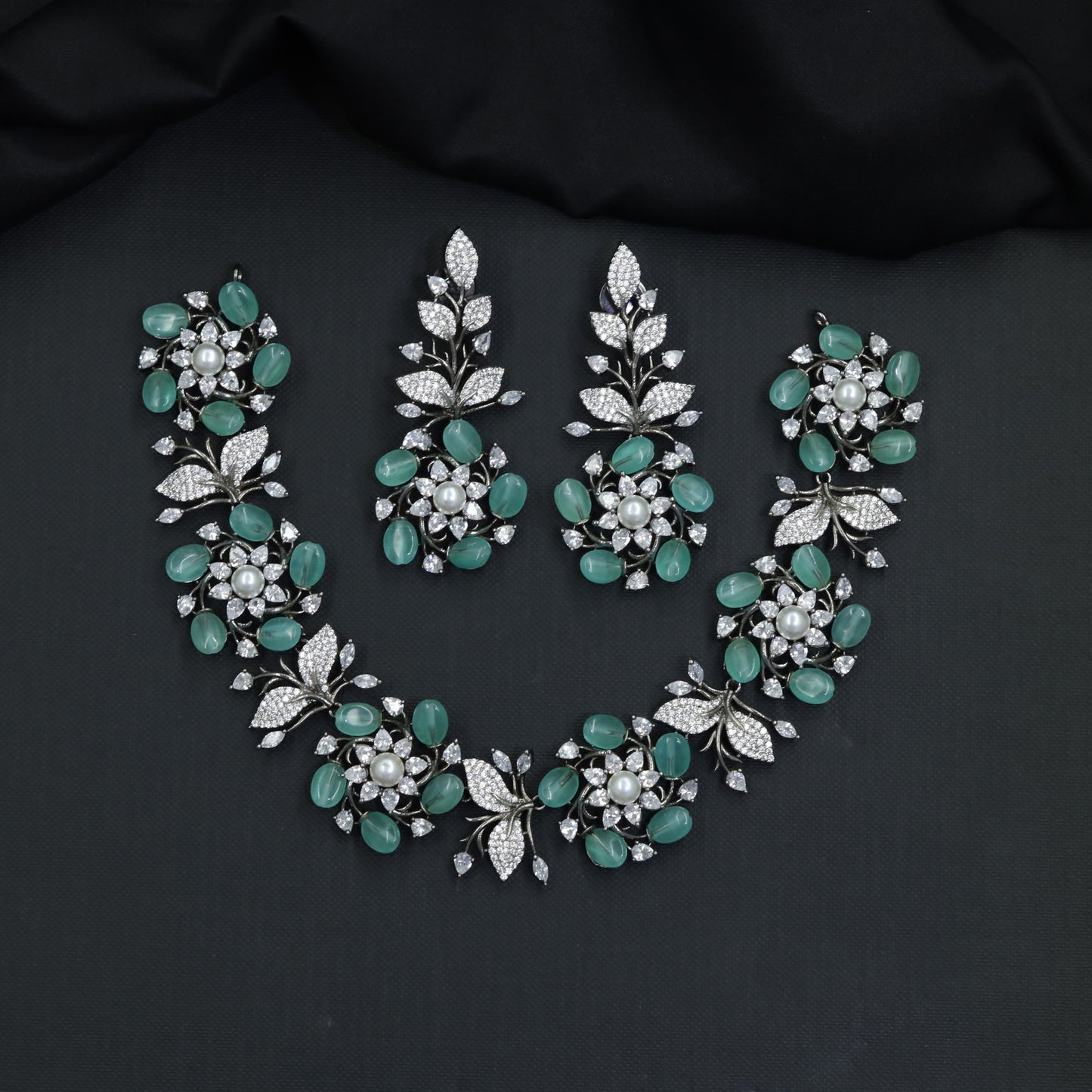 Signature floral Oxidised Necklace with pearl-like centres and curved leafwork