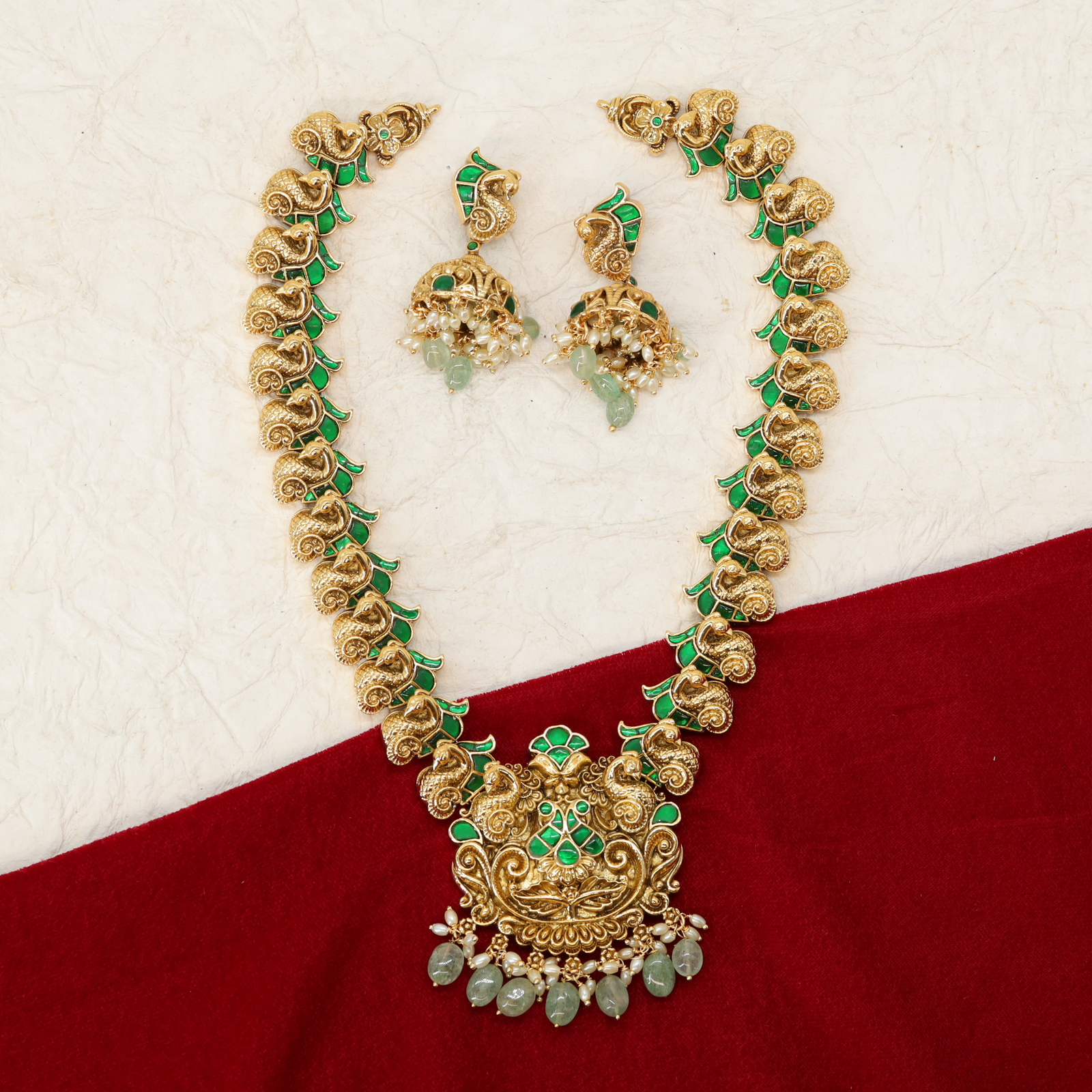 Curved Peacock Design Long Necklace with Repeating Motifs and Drops