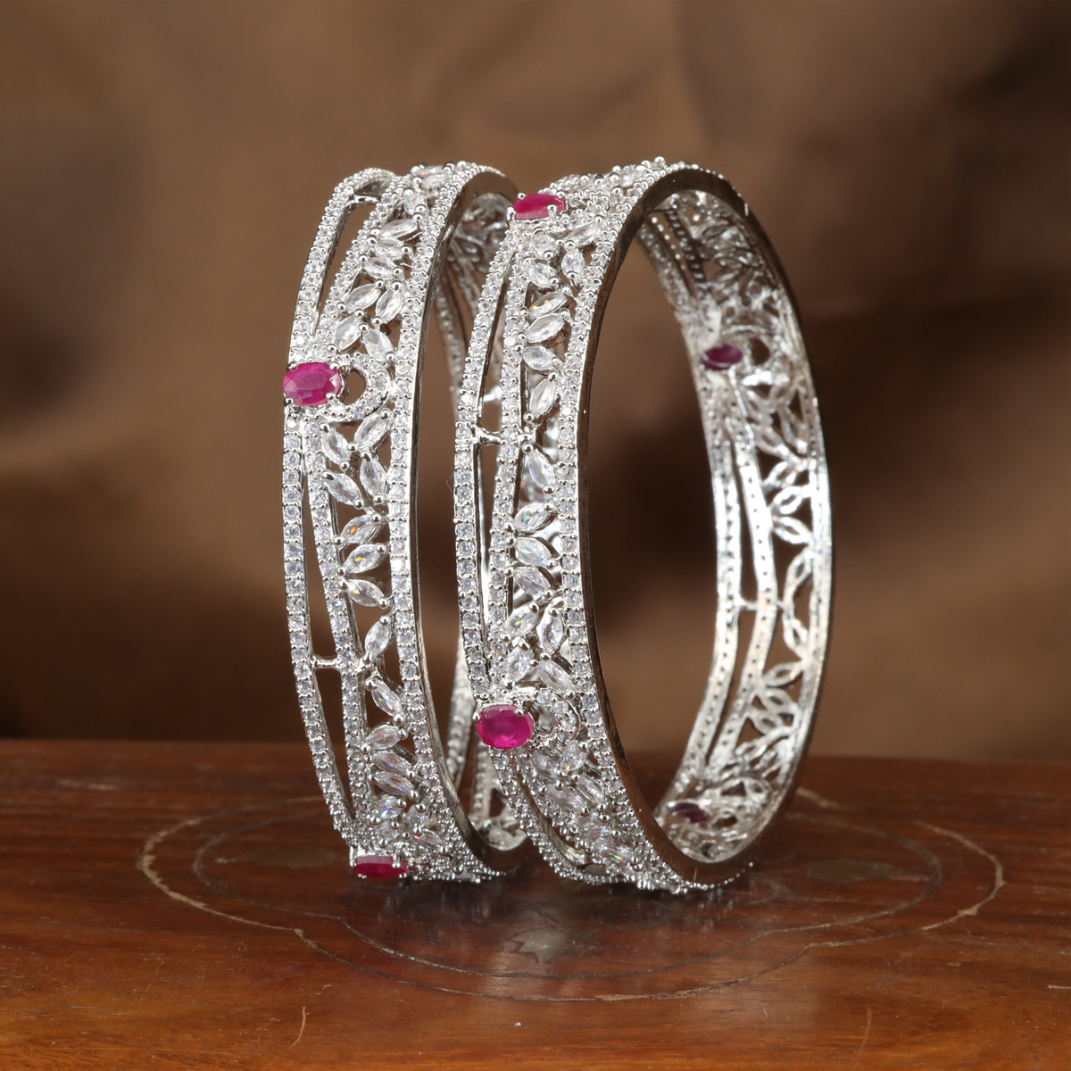 Graceful Leaf Trail Rhodium Bangles with Ornamental Frame Detailing
