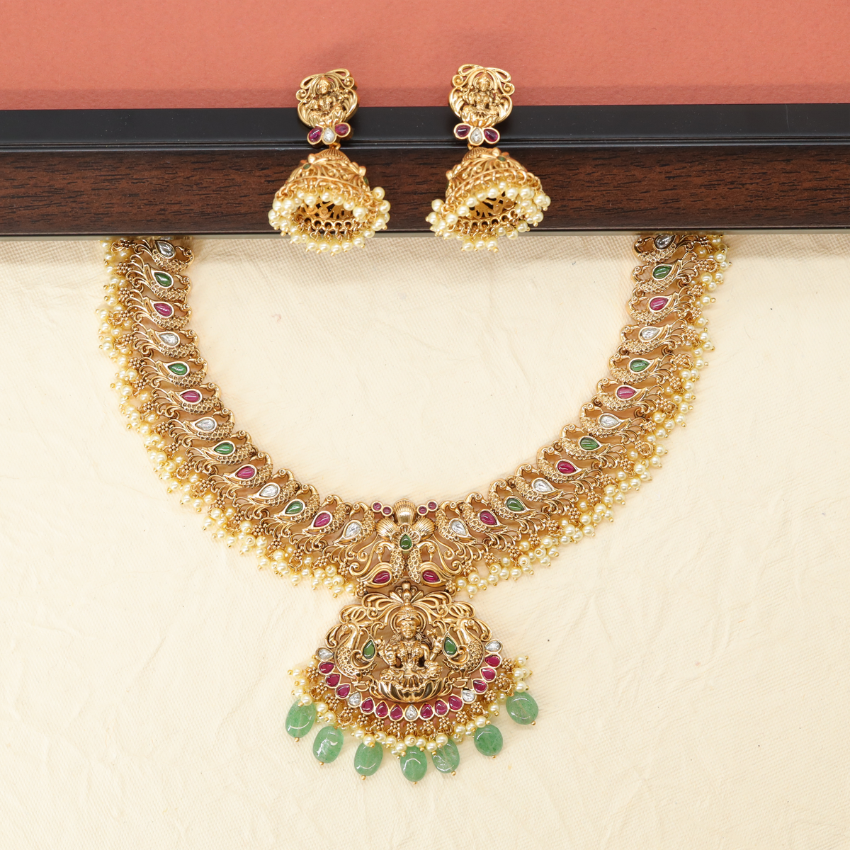 Divine Paisley Pattern Necklace with Sculpted Pendant and Gem Tassels