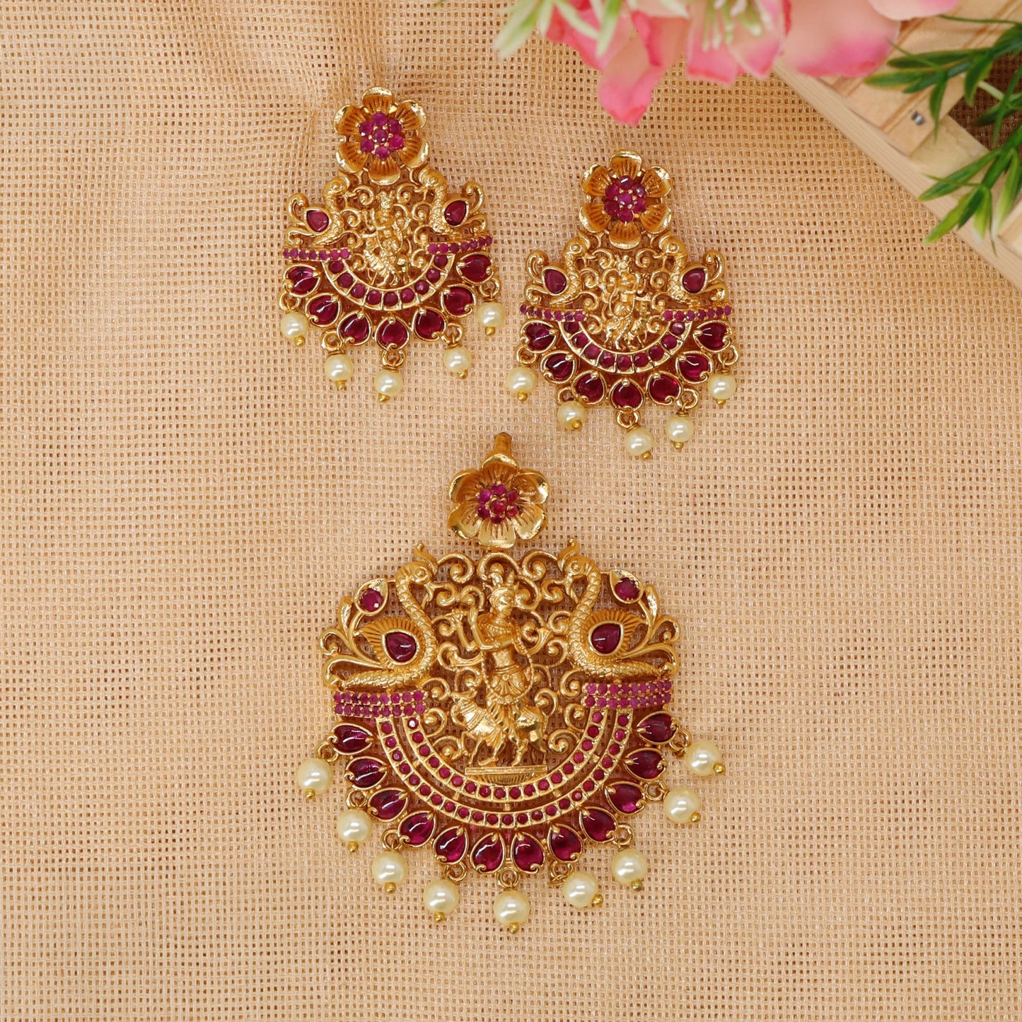 Antique Krishna pendant set with floral crown and intricate ornamental framing