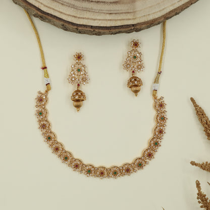 Scalloped floral antique necklace with repeating round panels and fine drop accents