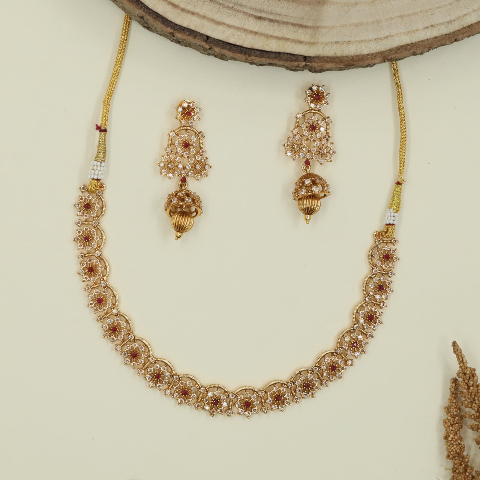 Scalloped floral antique necklace with repeating round panels and fine drop accents