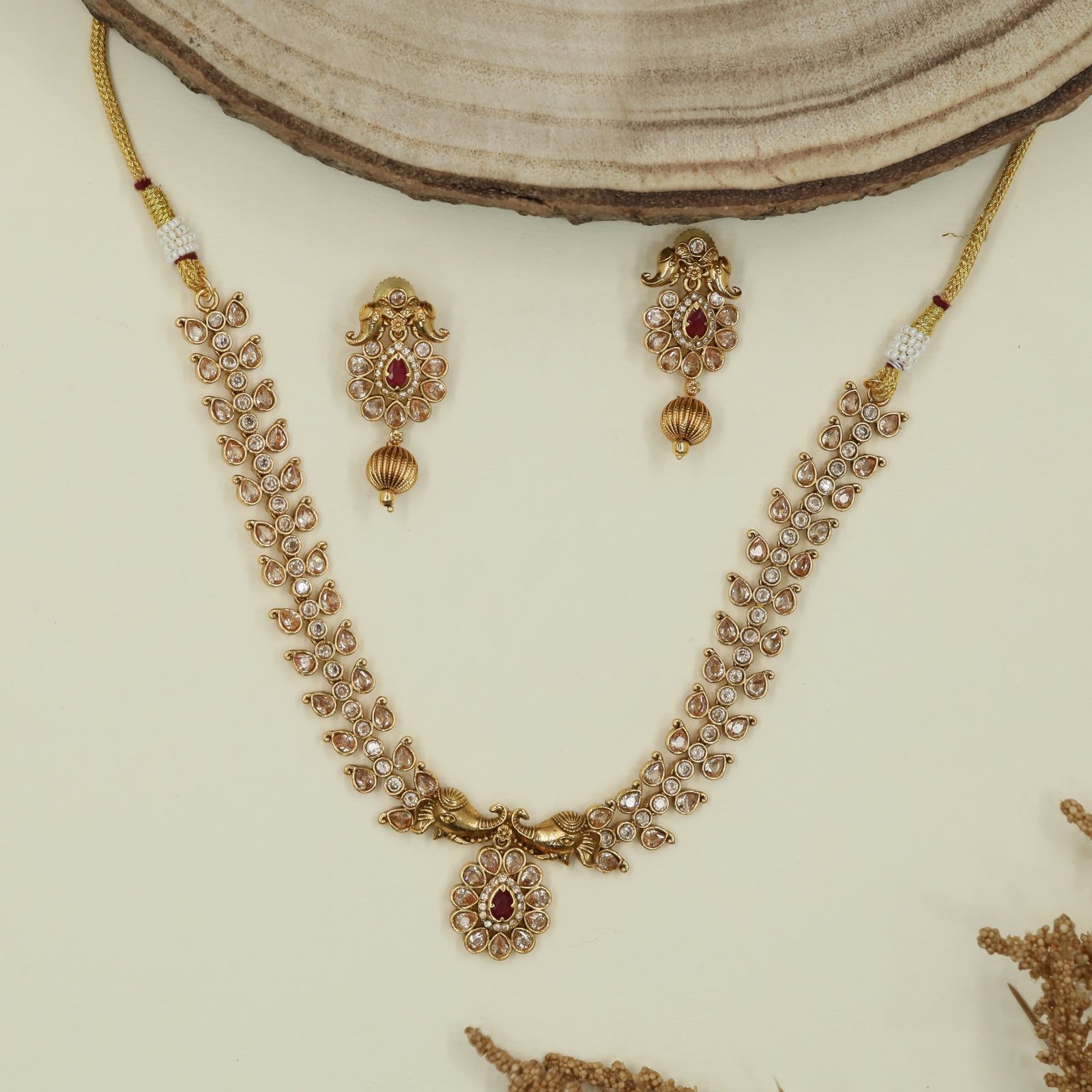 Feather pattern antique necklace with twin peacock side panels and drop centerpiece